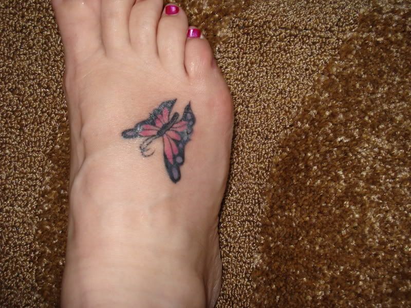 pretty foot tattoos. lily foot tattoos