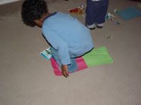 Boy stepping on paper 2