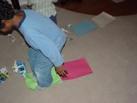 Boy stepping on paper 3