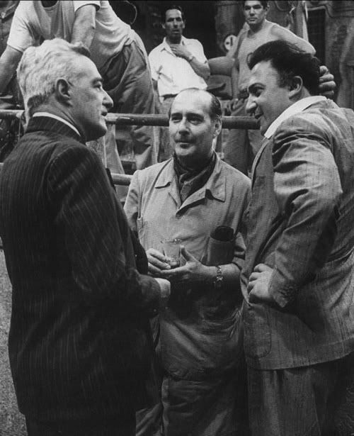 Roberto Rossellini center with De Sica and Fellini