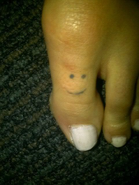 smileyface toe tattoo