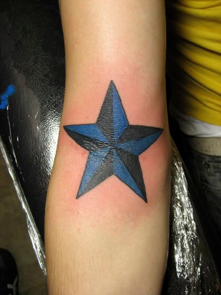 star tattoo on elbow. nautical star tattoo elbow